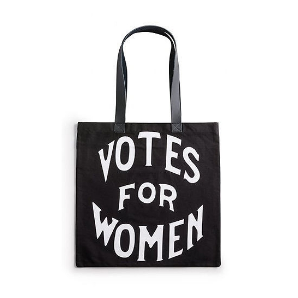 Black tote bag with a black handle and white font that reads "Votes for Women"