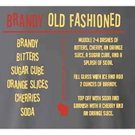 Backside of the t-shirt gives the recipe for a Brandy Old Fashioned in an orange and yellow font.