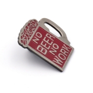 This beer stein shaped pin has a dark red background with a silver outlining of the mug and beer foam. The silver text reads "No Beer No Work".