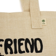 A zoomed in image of the tote shows a small tag near the handle that reads "Hemp".