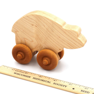 Handcrafted Wooden Bear Push Toy in Maple next to ruler