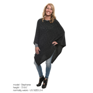 A blonde woman models the black poncho reaching knee-length, with blue jean pants. Text below the picture indicates that the model is 5 feet 6 1/2 inches tall and wear US sizes 2-4.