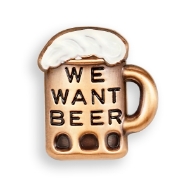 The lapel pin is mug shaped with beer foam at the top of the mug.  The pin is copper toned with the foam "top" painted white, and black text on the mug reading "We Want Beer".
