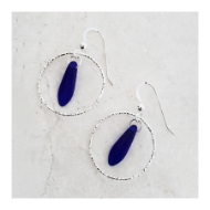 Two dark blue sea glass earrings set in sterling silver hoops. Shepherd hooks.