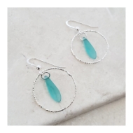 Two sea light turquoise glass earrings set in sterling silver hoops. Shepherd hooks.