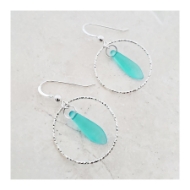 Two sea glass earrings set in sterling silver hoops. Shepherd hooks. 