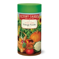 Puzzle canister holiding "Victory Garden" puzzle with colorful, vintage illustrations of fruits and vegatables. 