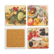Four ceramic stone coasters with vintage produce illustrations. One coaster turned over to show cork backing.