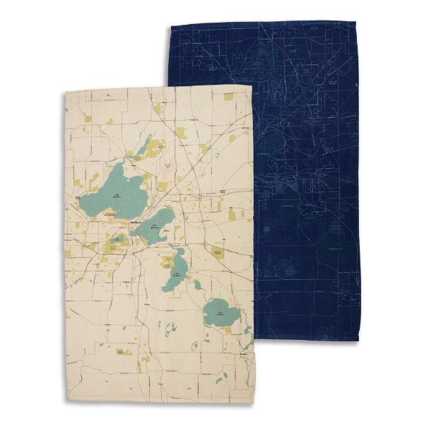Two Madison Lakes & Streets hand towels in different styles. Light "Sea Glass" style in front and dark "Blueprint" style in rear.