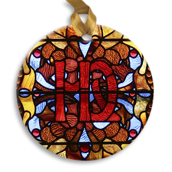 Round holiday ornament with a stained glass window design from Villa Louis historic site. Red, blue, orange.