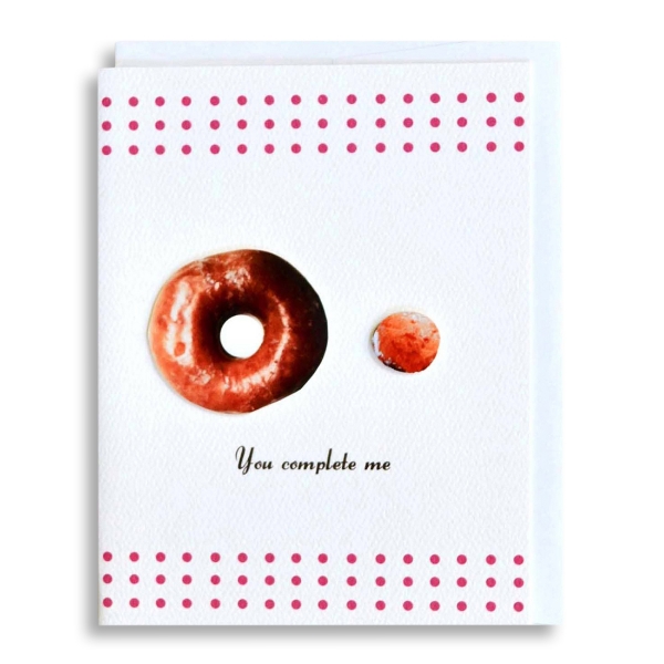 Greeting card with picture of donut and donut hole with words that read "You complete me."