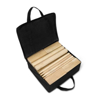 Kubb yard black carrying case with wooden game pieces inside.