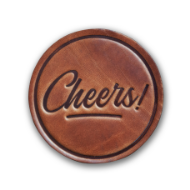Round, brown, leather coaster that says "Cheers!"