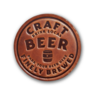 Round, brown, leather coaster that says "Craft beer, finely brewed."