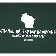 Illustration on back of 2018 NHD T-shirt. Silhouette of Wisconsin with caption that reads "National History Day. Making History Since 1848."