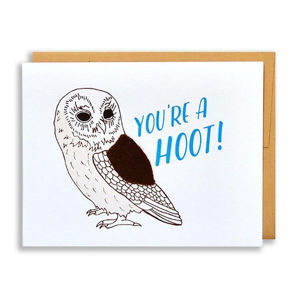 "You're a Hoot" greeting card with line drawing of an owl with a brown felt wing. A brown envelope is behind the white card.