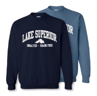 Two Lake Superior sweatshirts, one dark blue (in front) the other light blue (behind). Caption under the arching "Lake Superior" banner reads "Unsalted and Shark Free."