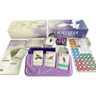 Wingspan European Expansion game open box to show contents including game cards with bird illustrations, violet egg tokens, and information sheets.