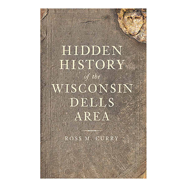 Book cover of "Hidden History of the Wisconsin Dells Area" showing the title superimposed over a photograph of a flat gray stone.