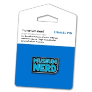 Museum Nerd pin with blue enamel text that says "Museum Nerd." The pin is mounted on blue display card.