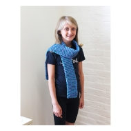 Young girl modeling long blue "quick to knit" scarf.
