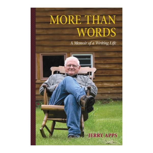 Book cover of "More than Words" by Jerry Apps with a photo of Mr. Apps sitting outside in a rocking chair on green grass with a building behind with brown wood siding.