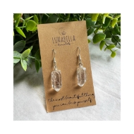 Quartz Earrings 2-Up image with clear crystal earrings attached to brown paper packaging. 