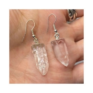 Quartz Earrings held in hand with close up showcasing beautiful clear quartz with earring hooks. 