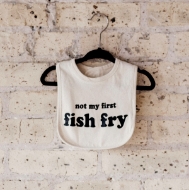 Not my first fish fry bib displayed hung up on a hanger