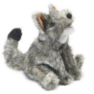 Grey coyote hand puppet in alert, seated position with fuzzy gray fur, black nose, black eyes, and gray tail with black tip.