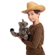 Boy in brown shirt and straw cowboy hat holds the fuzzy gray coyote hand puppet made by Folkmanis.