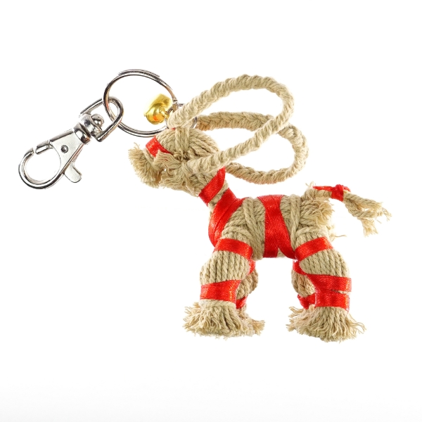 Yule Goat Key Chain including silver brass keychain attached to head of goat. Goat made of rope string with a red ribbon wrapped around body. 