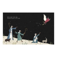 Inside look at the "Silent Night" children's book with an illustrated dessert scene at night. There a dark sky with white stars and one angel. There are three shepherds wearing white chaperons and gazing at the angel. 