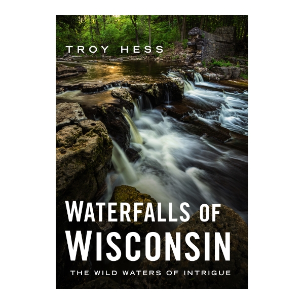 Book cover of "Waterfalls of Wisconsin" showing a color photograph of one of the state's waterfalls in a wooded setting. 