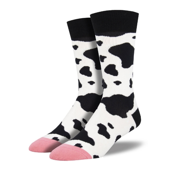 Cow Spot Crew Sock featuring black and white spotted cow patterns with a pink toe. 