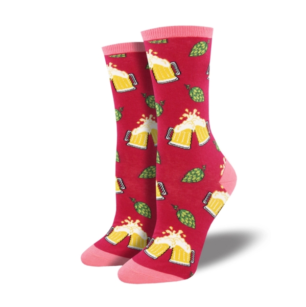 Hoppier Together socks in red featuring mugs of beer cheersing with green hops scattered about. Top edge, heel, and toe are pink.