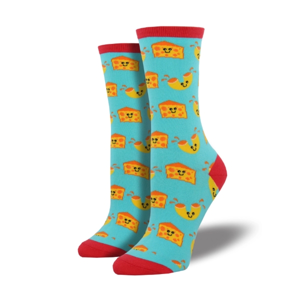 Mac n Cheese Sock in light blue featuring smiley faced blocks of cheese and macaroni noodles. Top edge, heel, and toe are red. 