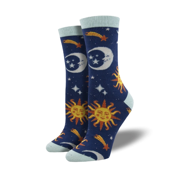 Clear Skies sock in dark blue featuring smiley suns and moons in a starry sky. Top edge, heel, and toe are light blue. 