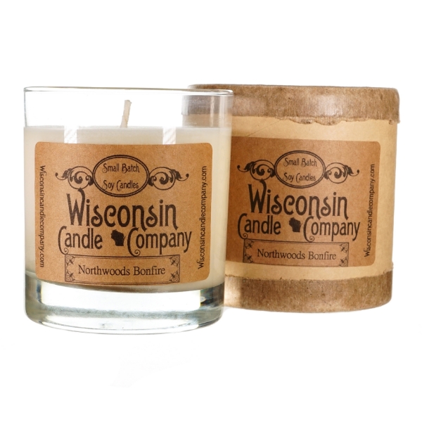Candle in cylindrical clear glass container with kraft-paper label. White wax. Black font says Wisconsin Candle Company. 