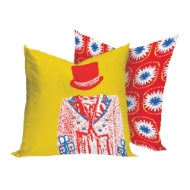 Two square decor pillows with colorful circus theme prints in yellow, red, and blue.