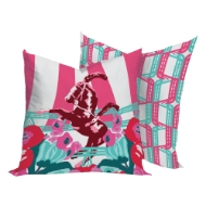 Two square decor pillows with colorful circus theme prints in brown, aqua, and fuscia.