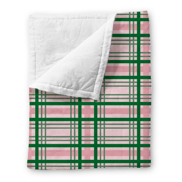 Prairie Life fleece throw blanket with green and mauve plaid pattern. 