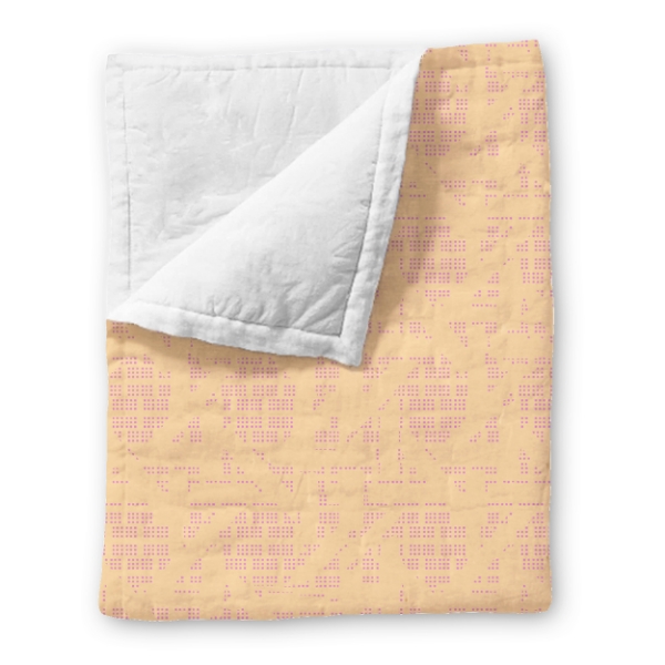 Fleece blanket in "Wildflower" style in "Fuschia" dot pattern over peach background. 
