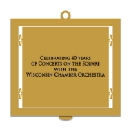 Back of 2023 State Capitol Ornament with inscription that reads "Celebrating 40 years of Concerts on the Square with the Wisconsin Chamber Orchestra." Black text on gold-tone metal. 