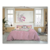 Bedroom setting to show duvet cover with fuschia wildflower design. 