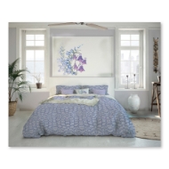 Bedroom setting to show duvet cover with viloet wildflower design. 