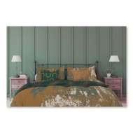Bed with comforter set with tan and green "Iron Works" "Rust" design. Green pillo with horseshoe motif.