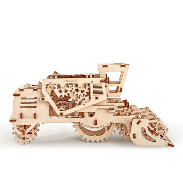 Small wooden model of combine harvester by UGears. Shown assembled, side view. 