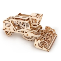 Small wooden model of combine harvester by UGears. Shown assembled, slightly elevated view from side. 