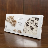 White rectangular product box for UGears Combine model. Shown on brown table from slight angle. 